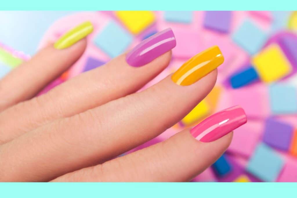 A close up of a woman's nails that are in many different colors